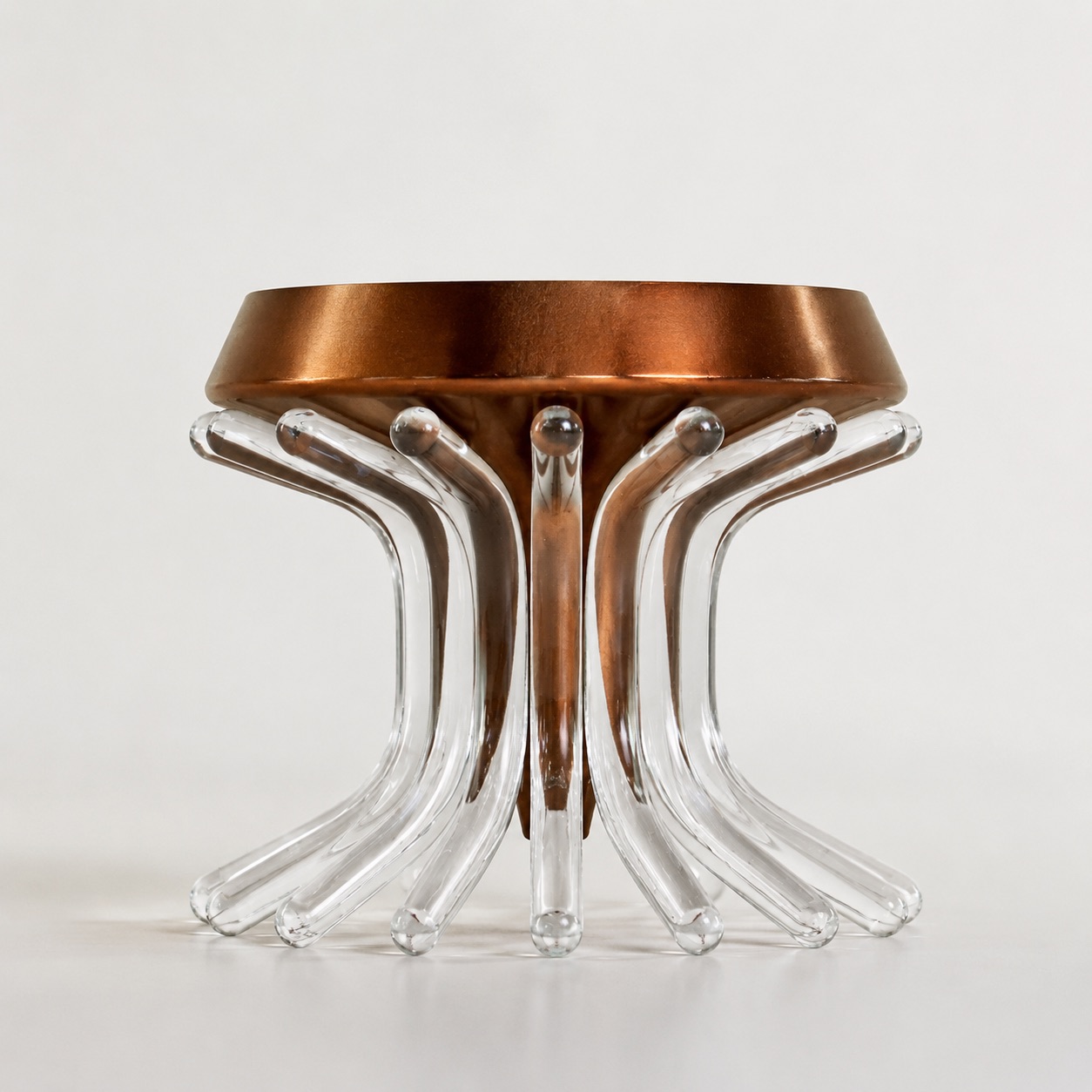 Copper Bloom vessel in transparent glass and polished copper