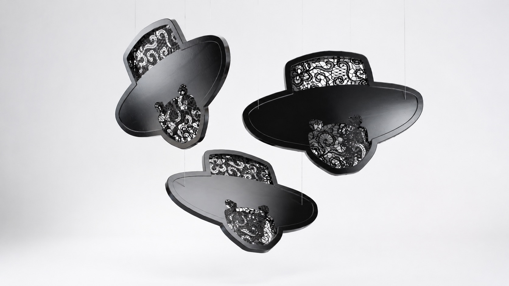 Hero Reliefs black sculptural wall objects with intricate openwork, view 2